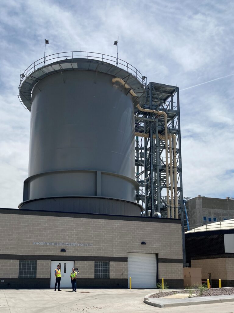 A view of the new Phosphorous Recovery Facility at the Robert W. Hite Treatment Facility (RWHTF) in Denver. The reactor is a tall, gray cylinder and is one of the more prominent structures at the plant site.  