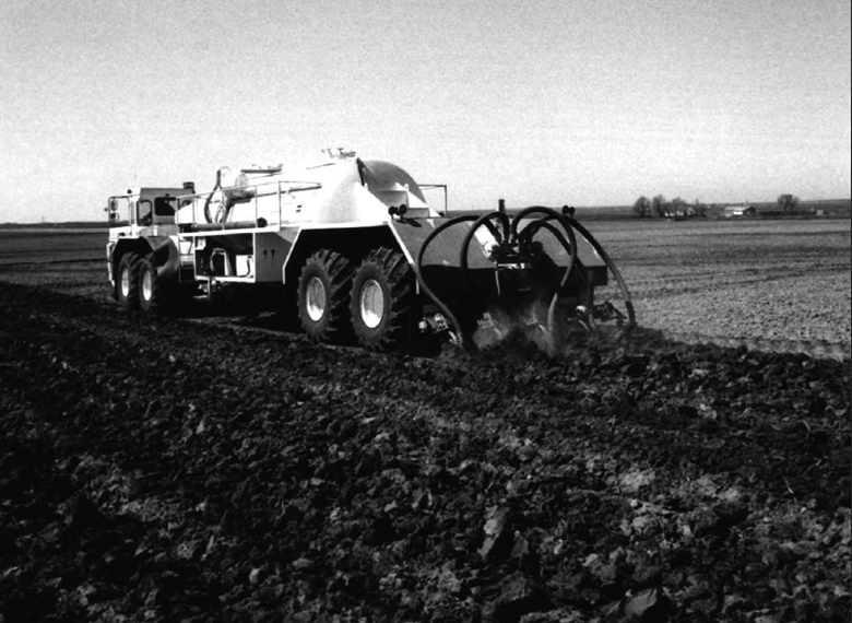 A old photo of a liquid spreader
