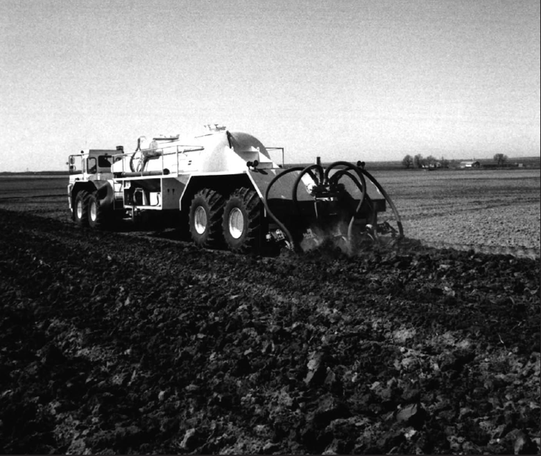 A old photo of a liquid spreader